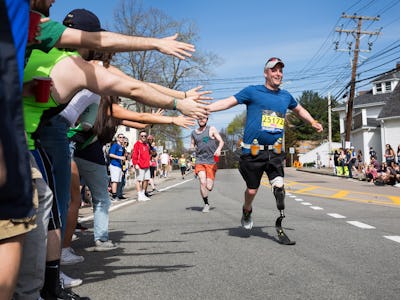 A man with a prosthetic leg at the finish line of the Boston Marathon 