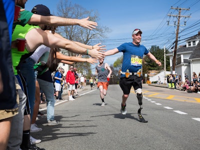 A man with a prosthetic leg at the finish line of the Boston Marathon 