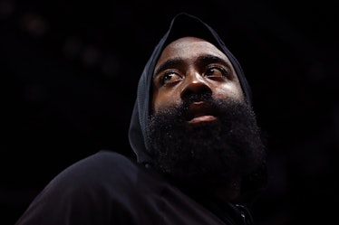 James Harden wearing a hoodie while warming up for a game