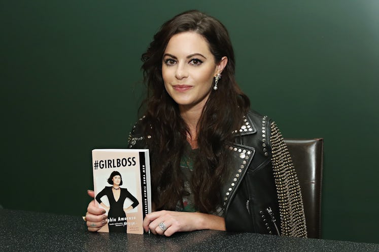 Sophia Amoruso posing with the "#Girlboss" book