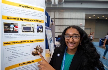 Meghana Bollimpalli shows off her poster board for the Intel International Science and Engineering F...
