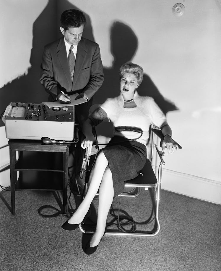 Original Caption: 6/4/1954- Lie detector being demonstrated by Dr. Fred Inbau, professor of criminal...