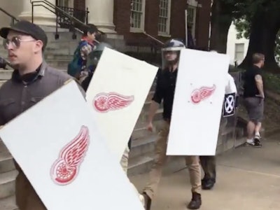 Neo-Nazis carrying the Detroit Red Wings logo on the neo-Nazi and far-right rally.