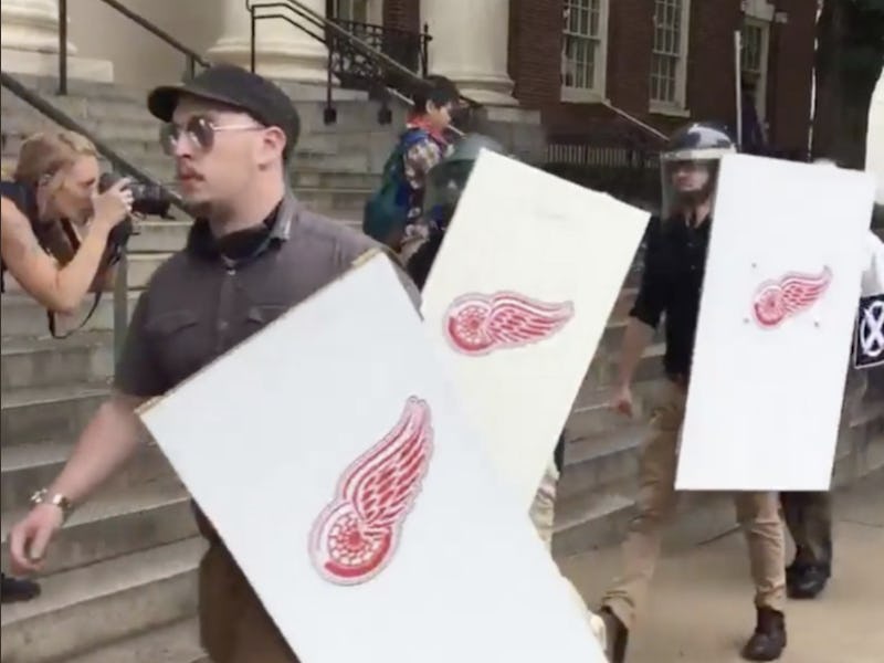 Neo-Nazis carrying the Detroit Red Wings logo on the neo-Nazi and far-right rally