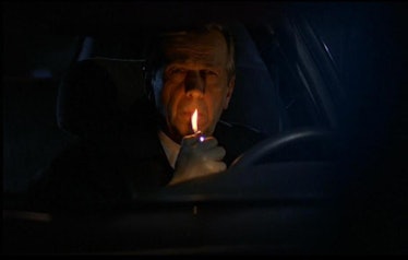 X Files scene where a male character is lighting a cigarette 