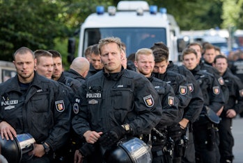 HAMBURG, GERMANY - JULY 06: Police wait at Hamburg harbor near the 'Welcome to Hell' anti-G20 demon...