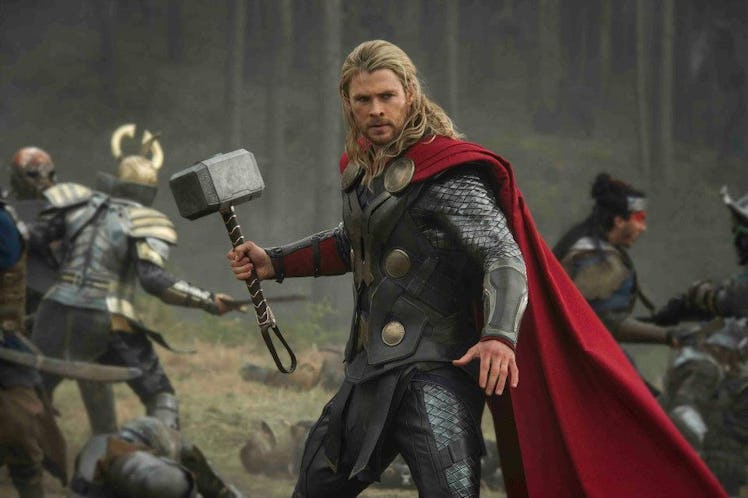 Thor brandishing his hammer in the middle of battle in 'Thor: The Dark World.'