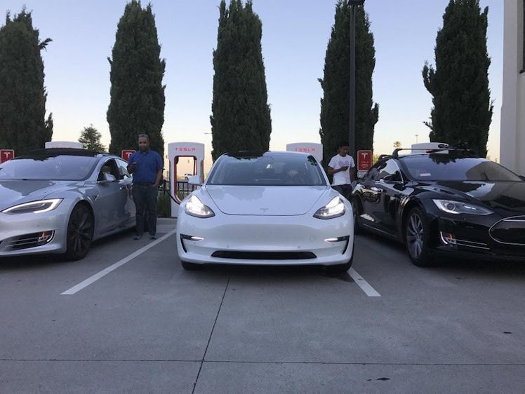 Here's the Model 3 in the middle next to two Model S's. 