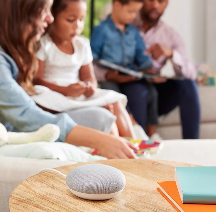 Google Home Mini device on a table in a living room