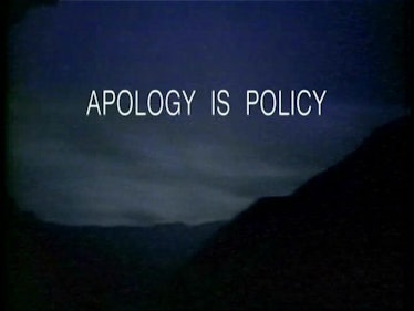 "Apology is policy" text sign on a dark sky background