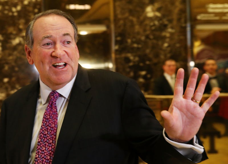 Mike Huckabee smiling and waving with his left hand