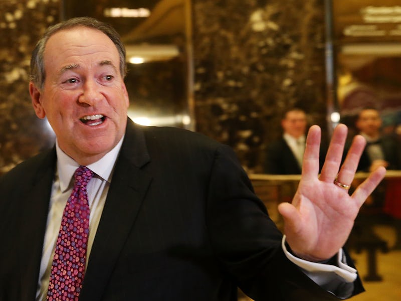 Mike Huckabee smiling and waving with his left hand