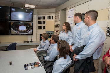 Astronauts observe Drop Tower at  Zero-G facility