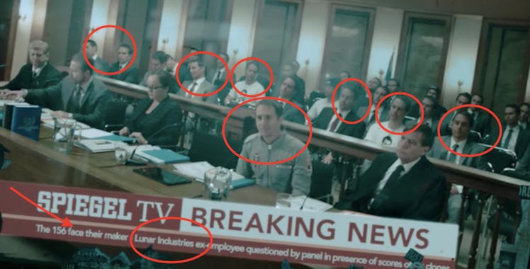 Multiple clones of Sam Bell (Sam Rockwell) from 'Moon' in a news broadcast seen briefly in 'Mute'