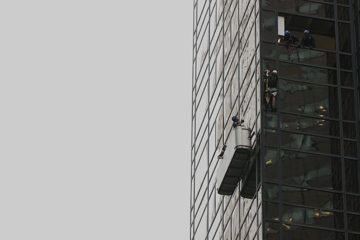 Steve, a climber, in a portable terrace on the Trump Tower