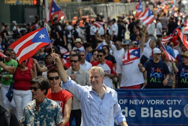 A man waving a Puerto Rican flag