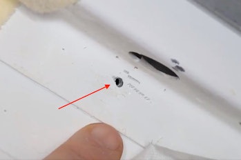 ISS hole with arrow annotation