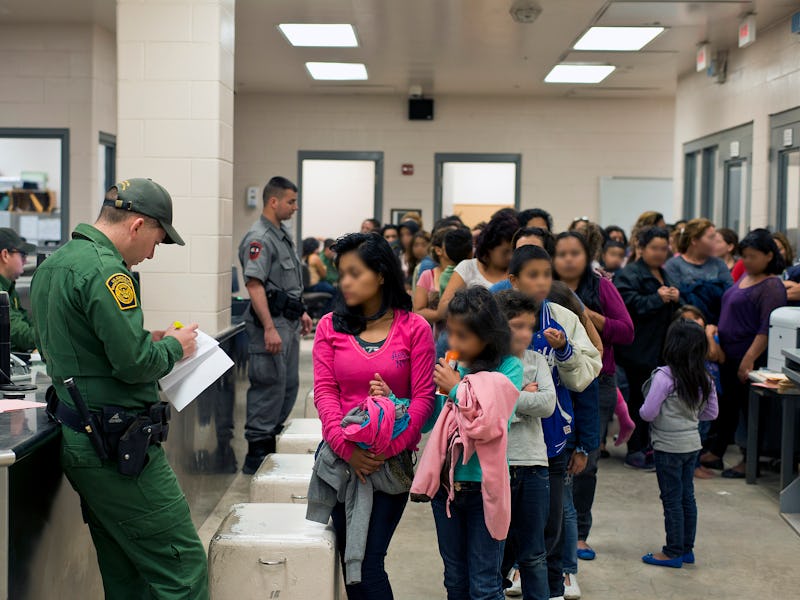 Police officers and kids in a school hallway
