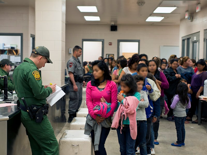 Police officers and kids in a school hallway