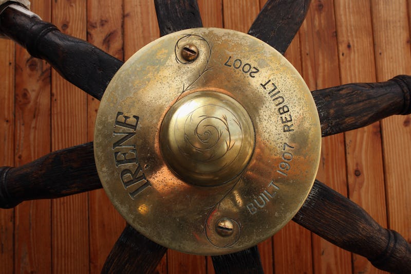 A golden boat name plaque with 'IRENE built 1907 rebuilt 2007' engraved text