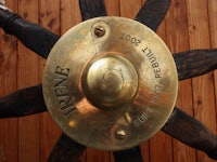 A golden boat name plaque with 'IRENE built 1907 rebuilt 2007' engraved text
