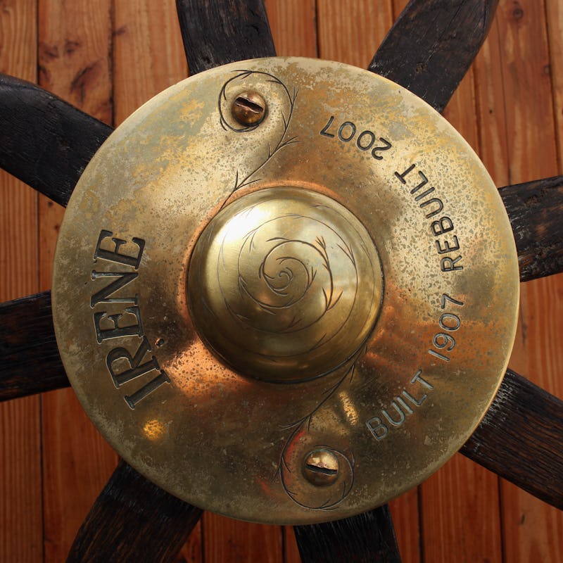 A golden boat name plaque with 'IRENE built 1907 rebuilt 2007' engraved text