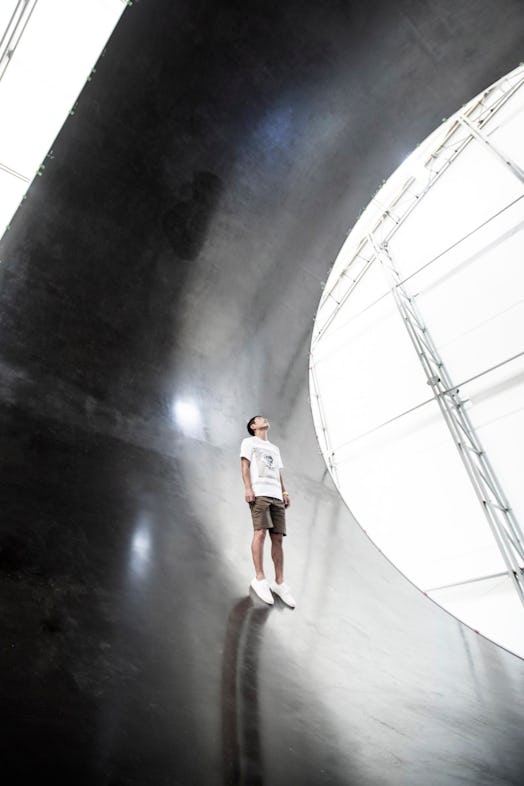 Yusaku Maezawa standing inside the BFR airframe.