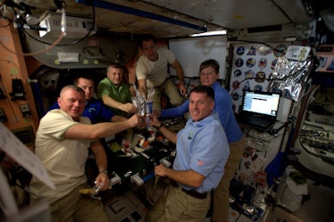 The six expedition 50 crew members celebrate Thanksgiving in space. 