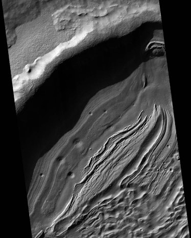 With a diameter of about 1,400 miles and a depth reaching the lowest elevations on Mars, Hellas is o...