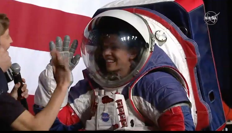 Davis demonstrates the spacesuit's added function of dexterity.