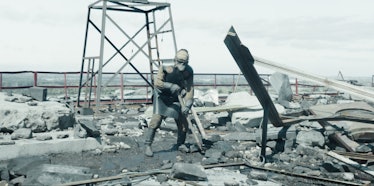 A "biorobot"-- a man in protective gear -- on the roof of the Chernobyl Nuclear Power Station, as de...