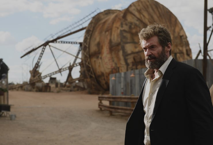 Hugh Jackman as Wolverine in a black suit and a white shirt