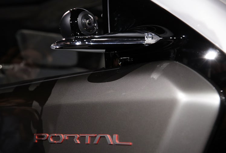The side mirror is replaced with a camera on the Chrysler Portal electric concept minivan at CES 201...