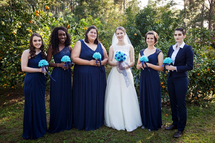 Bride with her bridesmaids, all holding the bouquets printed with the 3D printer.