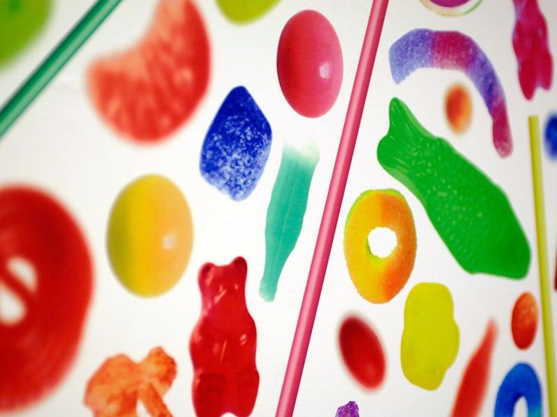 Many different Halloween candies on a white background