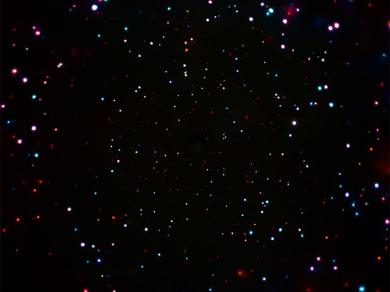 A dark sky with lots of visible stars glowing