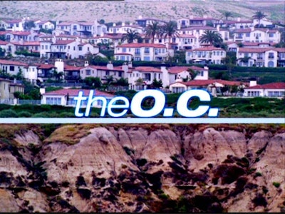 A beach village and "The O. C." series text sign