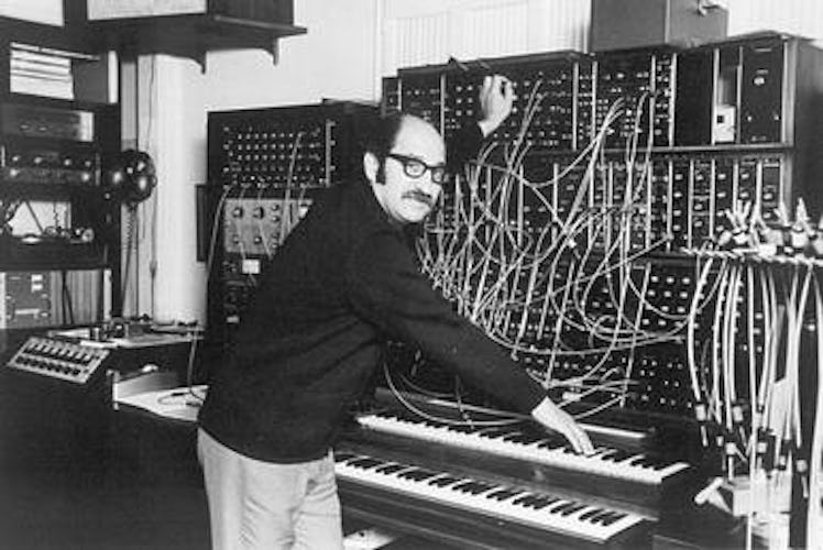 Black and white picture of Mort Garson working on the music