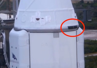 This zoomed-in photograph of the Dragon cargo capsule atop the Falcon 9 rocket on Thursday shows the...