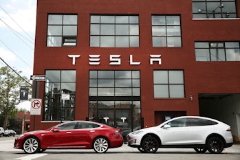 Tesla vehicles sit parked outside of a new Tesla showroom and service center in Red Hook, Brooklyn o...