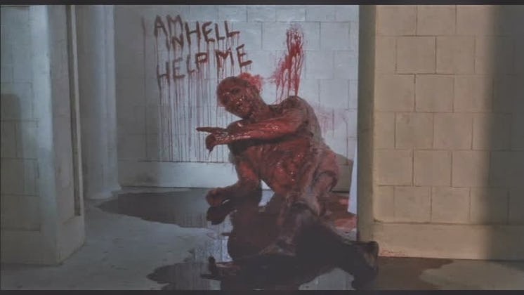 "I am in hell help me" text written with blood on a white wall in "Hellbound: Hellraiser 2"