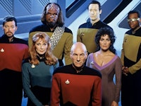 The cast from Star Trek posing together in their costumes