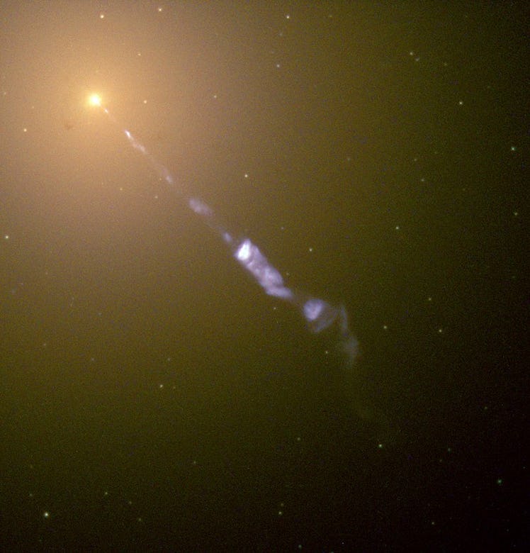 Elliptical galaxy M87 emitting a relativistic jet, as seen by the Hubble Space Telescope.