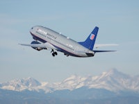 A United Airlines playing flying in the sky