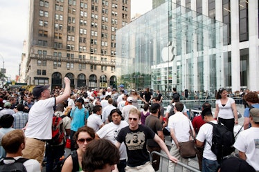 People waiting for iPhones in front of a shop back in 2007