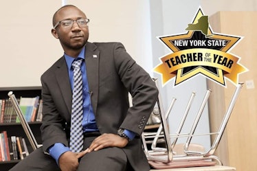 Alhassan Susso and New York State's "teacher of the year" sign 