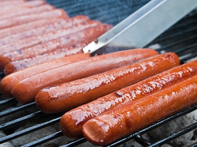 Hot dog sausages on a grill