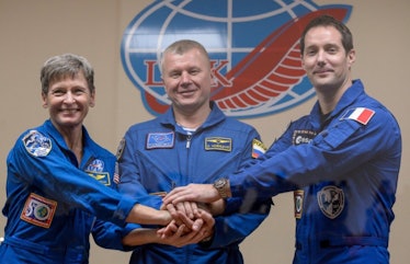 NASA astronaut Peggy Whitson, Russian cosmonaut Oleg Novitsky, and French astronaut Thomas Pesquet l...