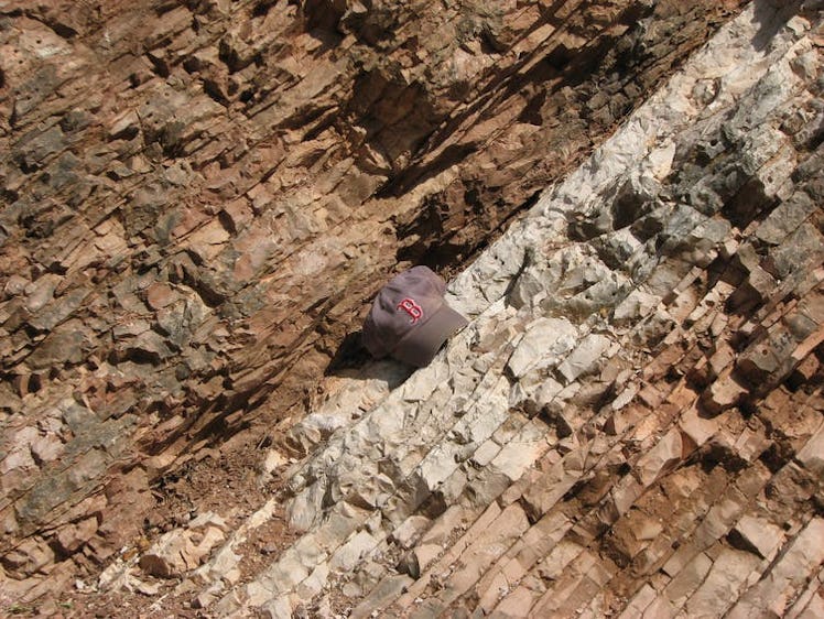 Rocks near Gubbio, Italy, change in color and texture at the line indicating the Cretaceous-Paleogen...