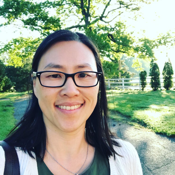 Dr. Irene Tien smiling while standing in a park on a sunny day